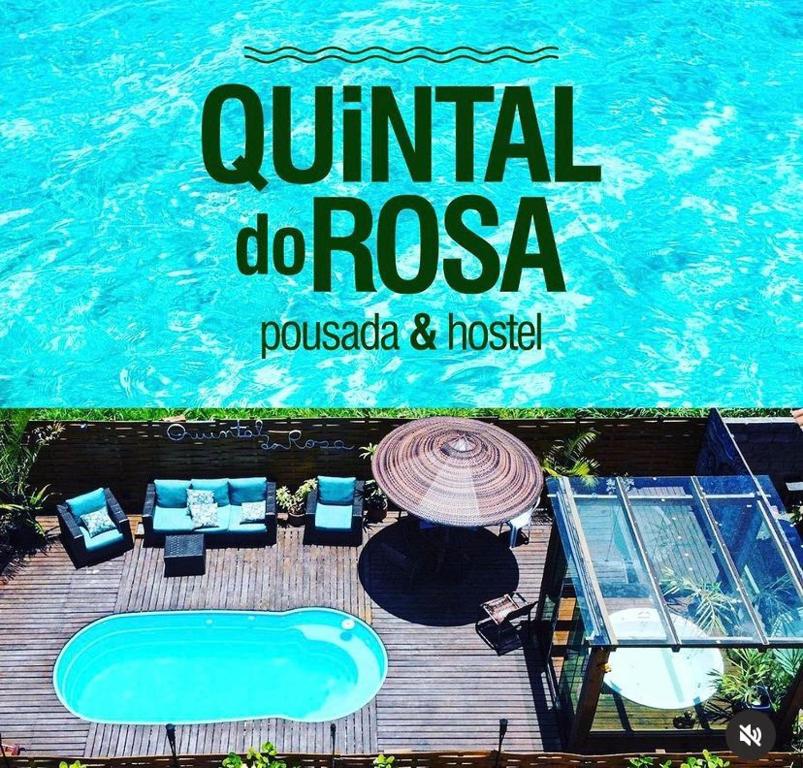 um sinal para um resort com piscina em Pousada - Quintal do Rosa na Praia do Rosa
