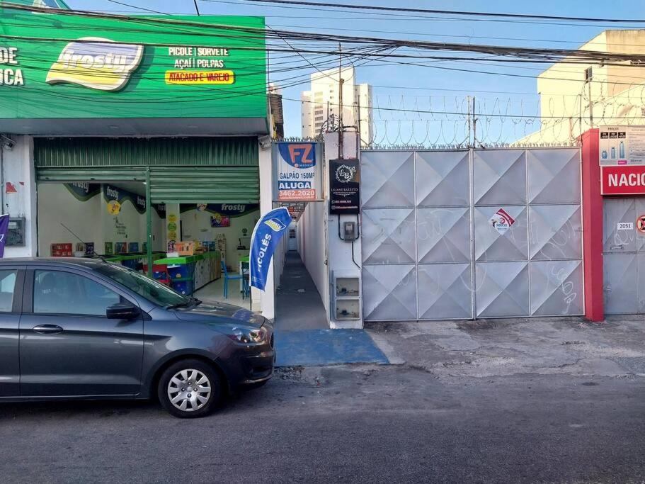 a car parked in front of a gas station at kitnet Cidade 2000 in Fortaleza
