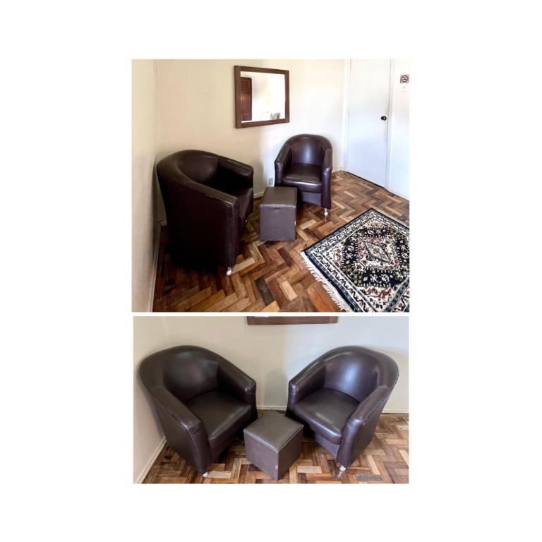 a room with two leather chairs and a rug at Hotel Ibiá in Montenegro