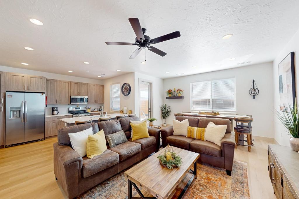 a living room with a couch and a ceiling fan at Santa Clara Basecamp in Santa Clara