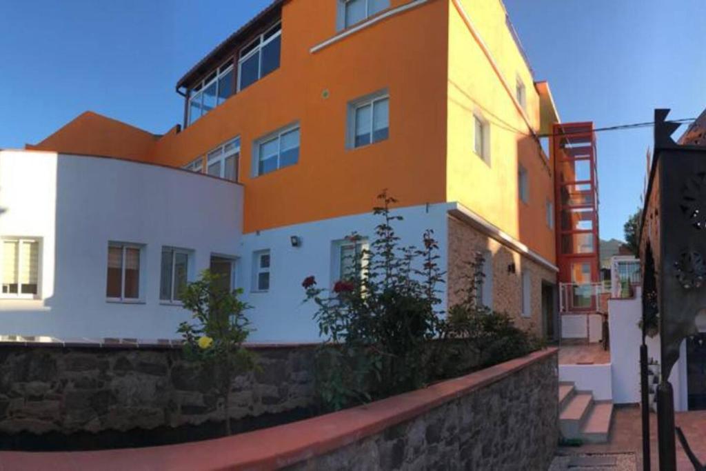 a building with an orange and white building at One bedroom appartement with wifi at San Cristobal de La Laguna 3 km away from the beach in Las Lagunas