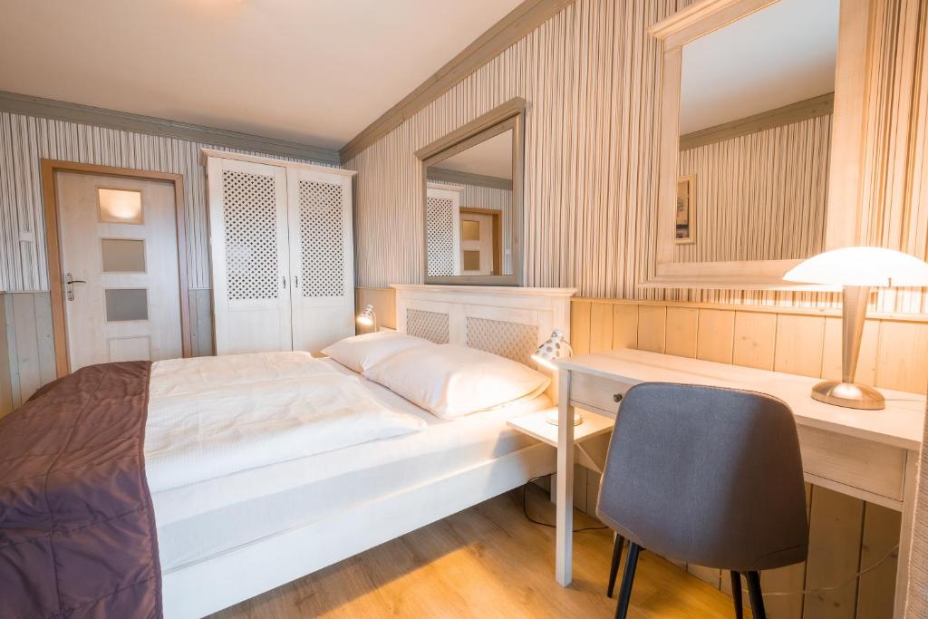 Postel nebo postele na pokoji v ubytování Hotel Maxant