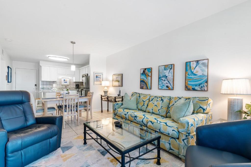 a living room with couches and a table at Gulf Shores Plantation-East 3210 in Gulf Shores