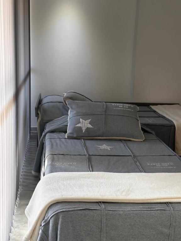 a row of beds lined up in a room at Loft & Wines in Maipú