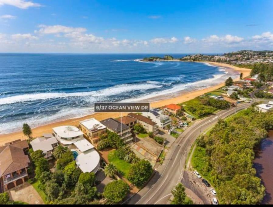 an aerial view of new ocean view villas on the beach at Terrigal Coastal Casa in Wamberal