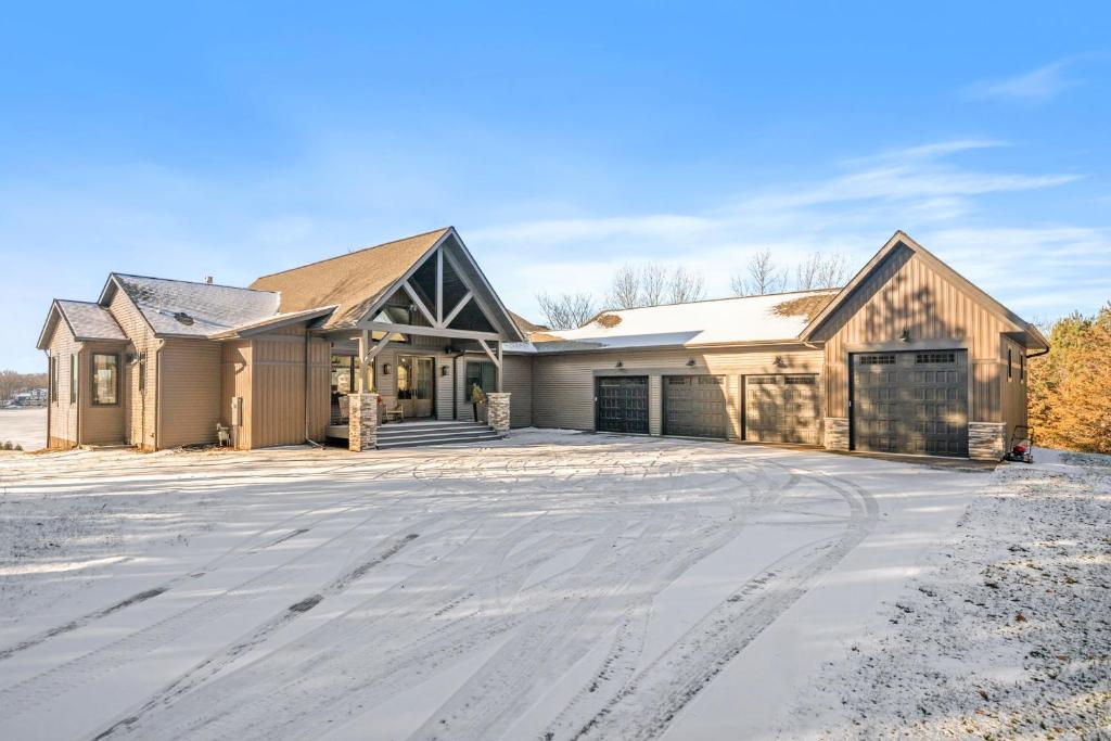 a house with a driveway in the snow at The Belle Retreat in Center City