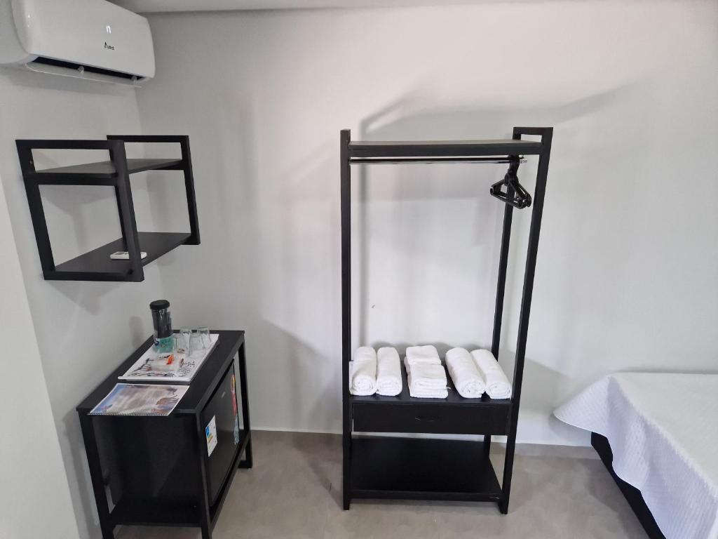 Postel nebo postele na pokoji v ubytování Condomínio Inn Studio