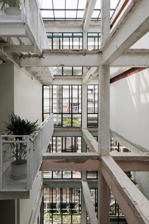 a view from the top of a building with stairs at C'HOUSE Bangkok in Pom Prap