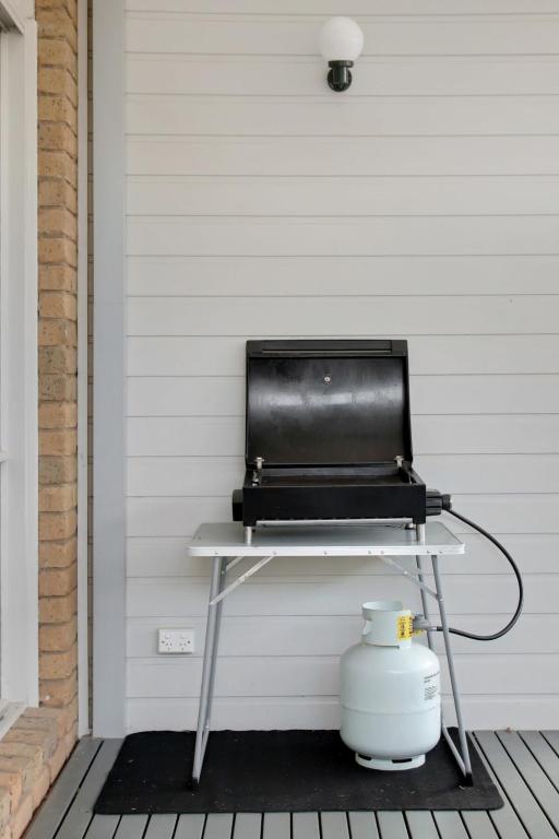 a grill sitting on a table on a porch at Seven Views I Pool Table n Water Views in Clifton Springs