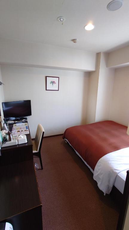 Postel nebo postele na pokoji v ubytování ホテルアイシス掛川