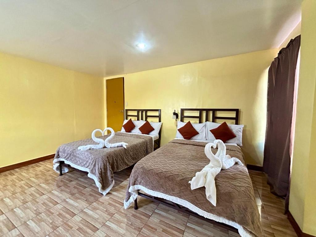 Postel nebo postele na pokoji v ubytování Elegance Guesthouse