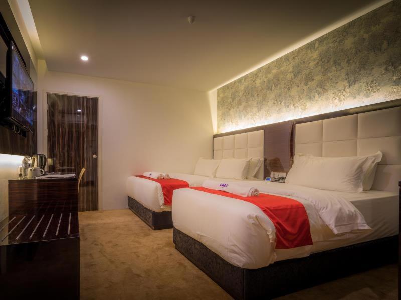 Postel nebo postele na pokoji v ubytování WIWO Hotel