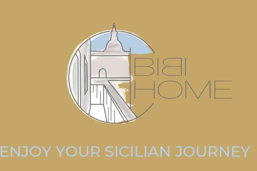 una foto de un edificio con las palabras "estar en casa disfrutar de su viaje sichuan" en BiBiHome Catania appartamento in centro storico, en Catania