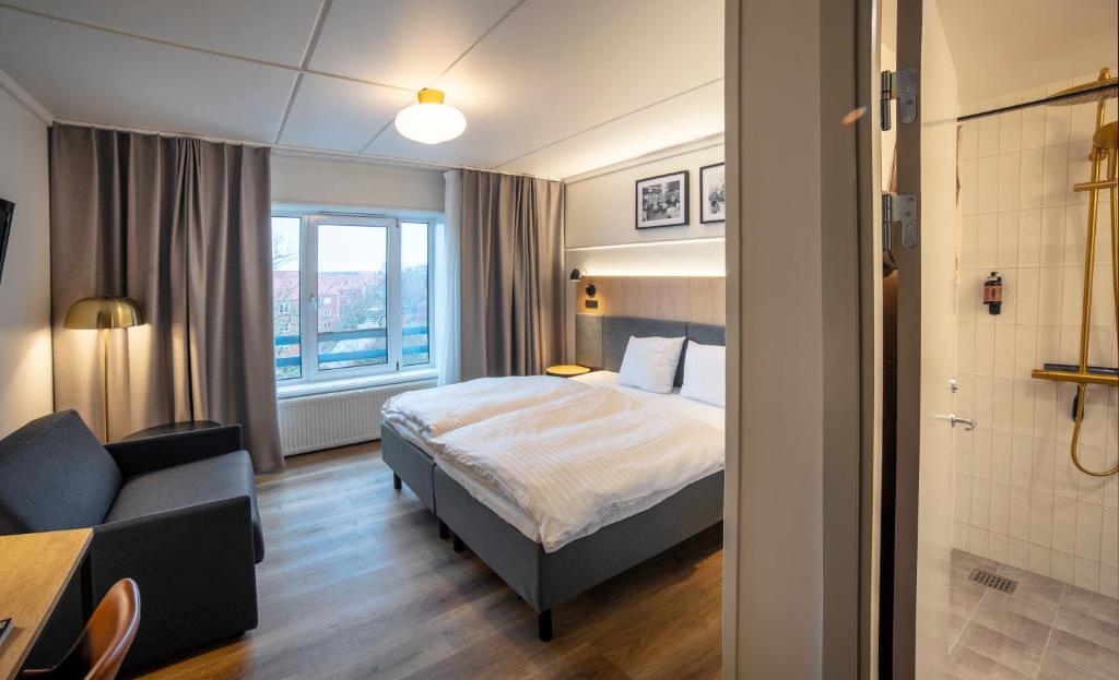 Postel nebo postele na pokoji v ubytování Go Hotel Herlev
