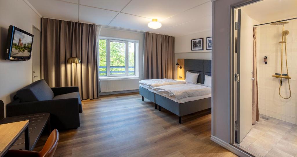 Postel nebo postele na pokoji v ubytování Go Hotel Herlev