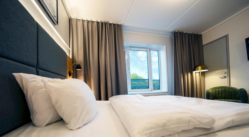 Postel nebo postele na pokoji v ubytování Go Hotel Herlev