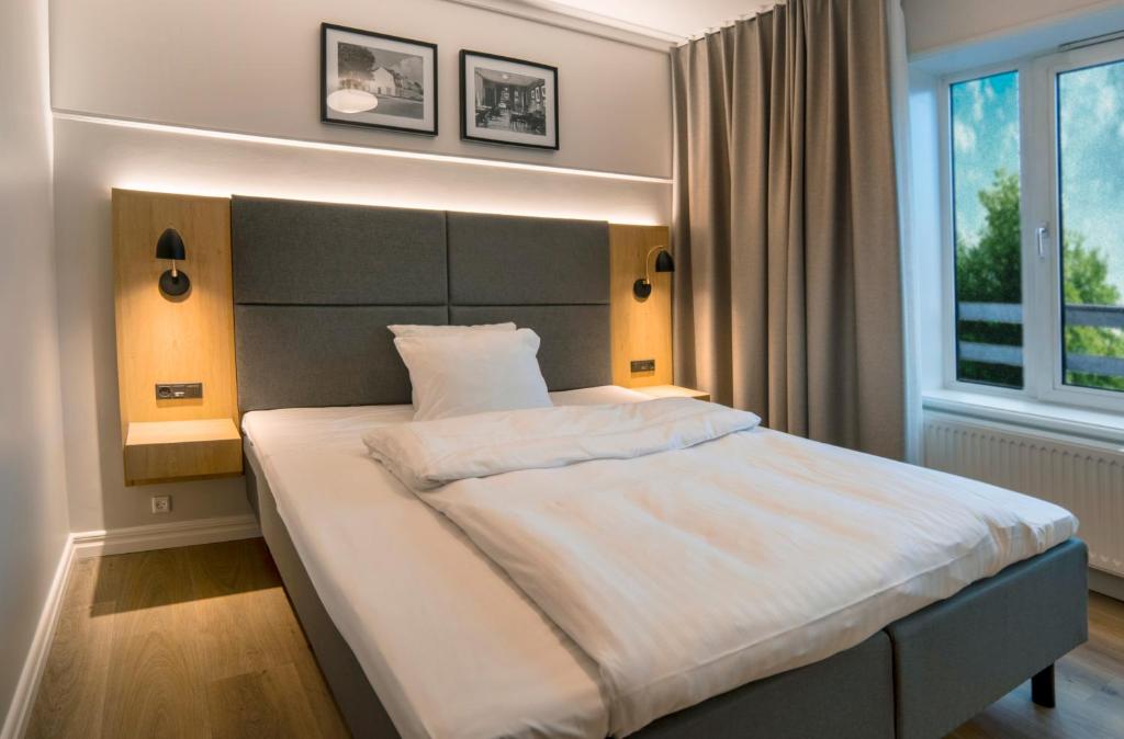 Postel nebo postele na pokoji v ubytování Go Hotel Herlev