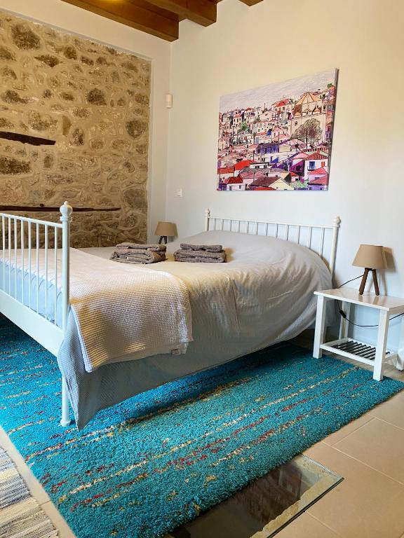Postel nebo postele na pokoji v ubytování Kranidi House.