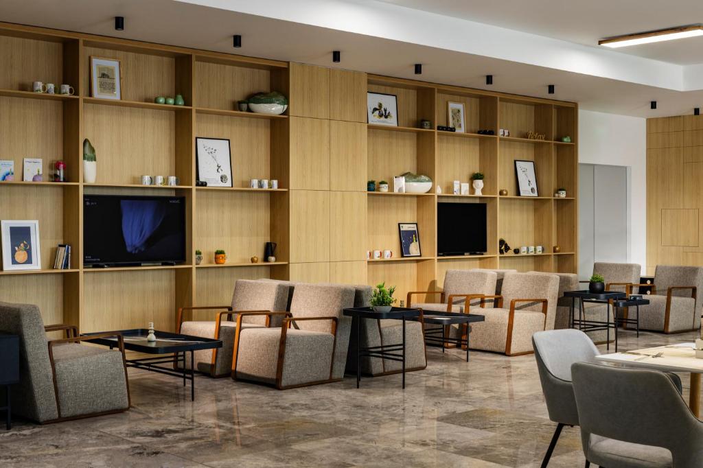 TV a/nebo společenská místnost v ubytování B1 City Hotel
