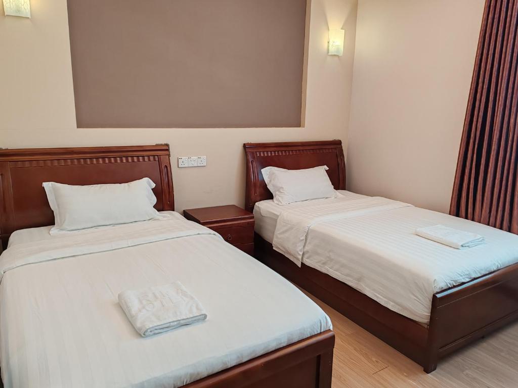 Postel nebo postele na pokoji v ubytování Hotel Prima