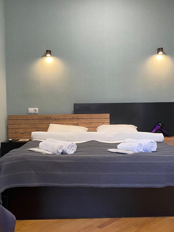Postel nebo postele na pokoji v ubytování Boutique hotel RaqWine