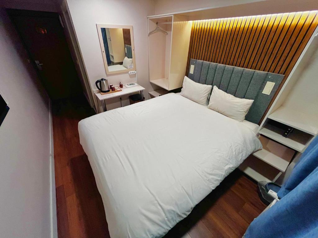 Postel nebo postele na pokoji v ubytování Naila Hotel