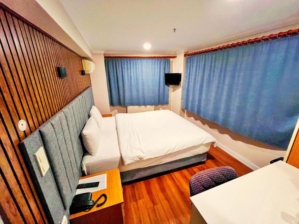 Postel nebo postele na pokoji v ubytování Naila Hotel