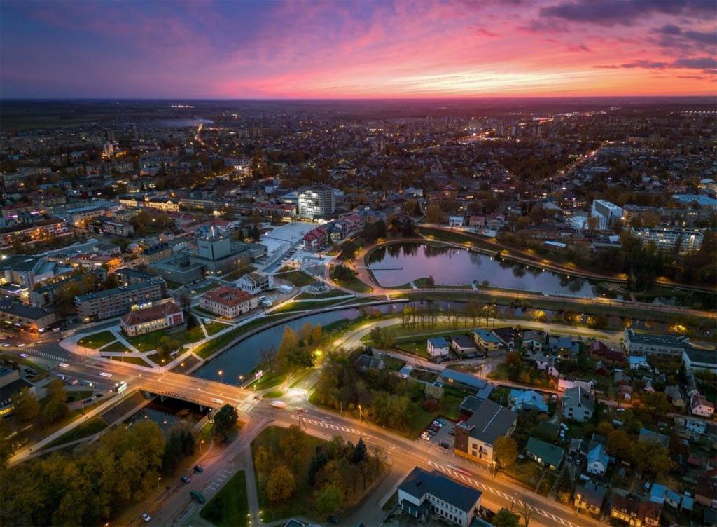 an aerial view of a city at night at B&B Panevėžys in Panevėžys