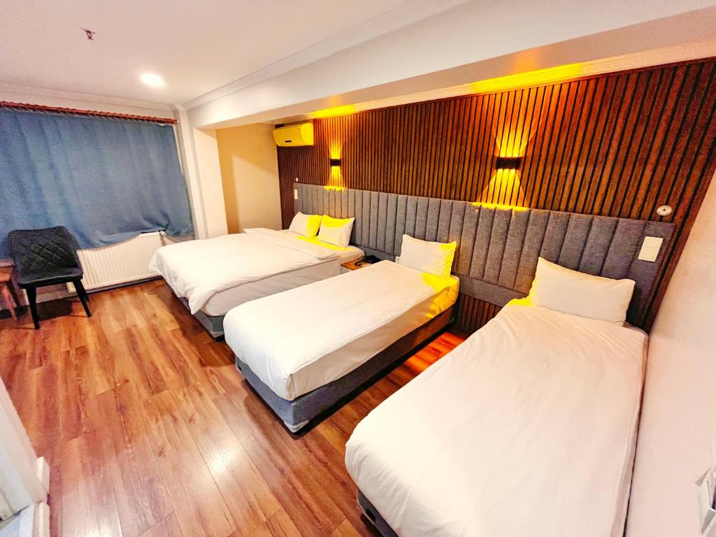 Postel nebo postele na pokoji v ubytování Naila Hotel