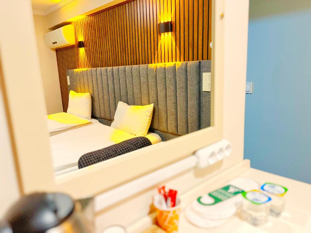 Postel nebo postele na pokoji v ubytování Naila Hotel