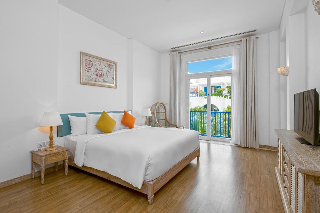 Letto o letti in una camera di Risemount Premier Resort Da Nang