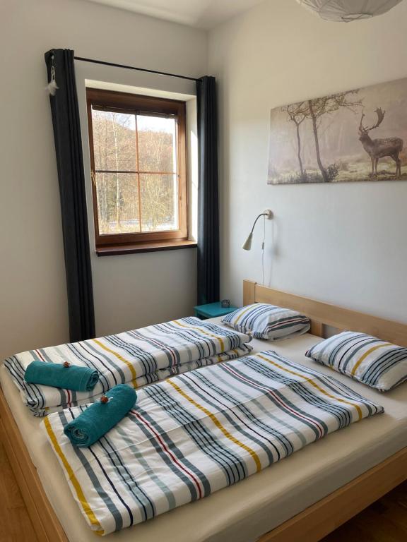 מיטה או מיטות בחדר ב-Apartman Jelen
