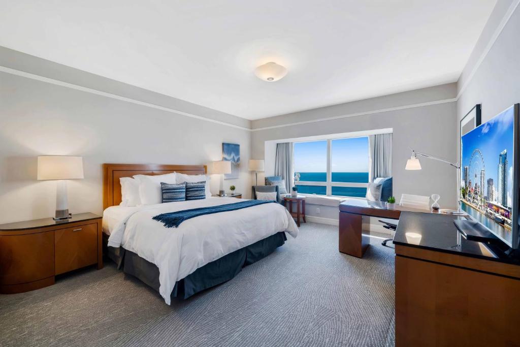 a large hotel room with a bed and a television at 1435 Brickell Ave 3004 in Miami