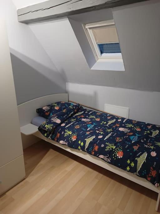 Postel nebo postele na pokoji v ubytování Gîte Chez l'Oncle Paul