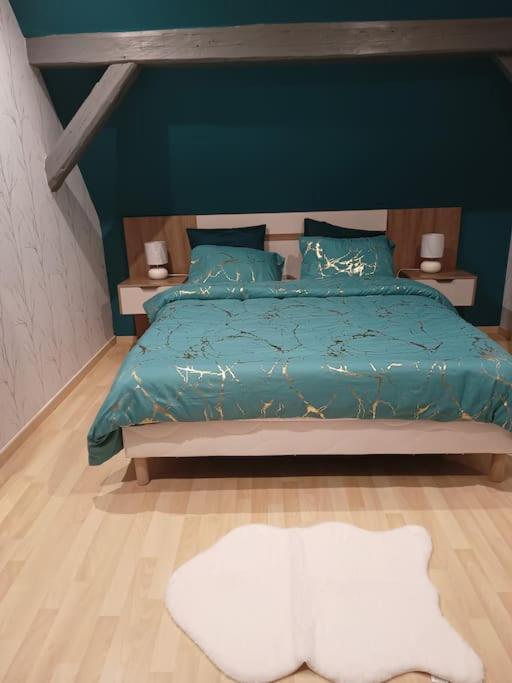Postel nebo postele na pokoji v ubytování Gîte Chez l'Oncle Paul