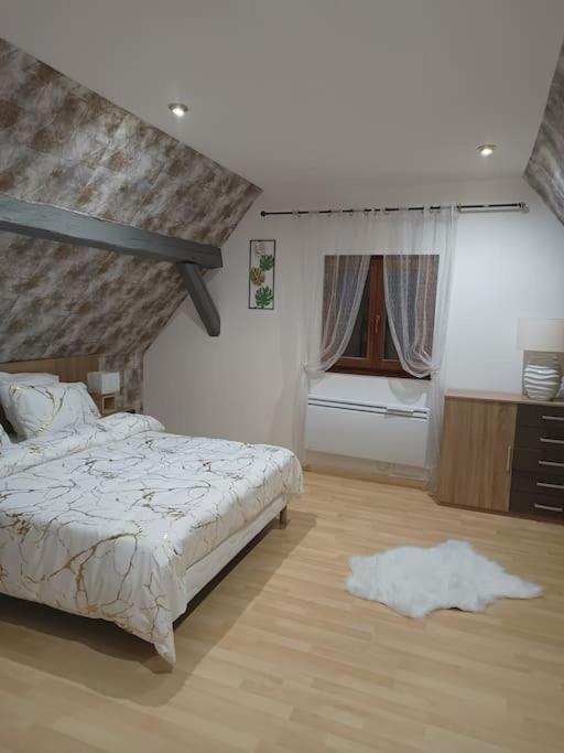 Postel nebo postele na pokoji v ubytování Gîte Chez l'Oncle Paul