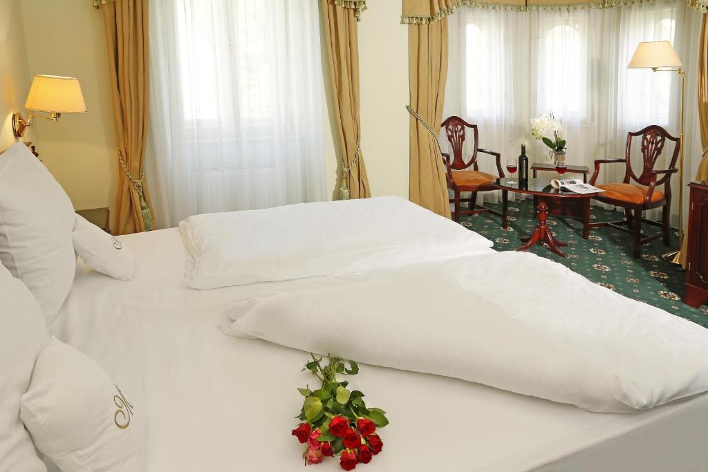 Postel nebo postele na pokoji v ubytování Hotel Mignon