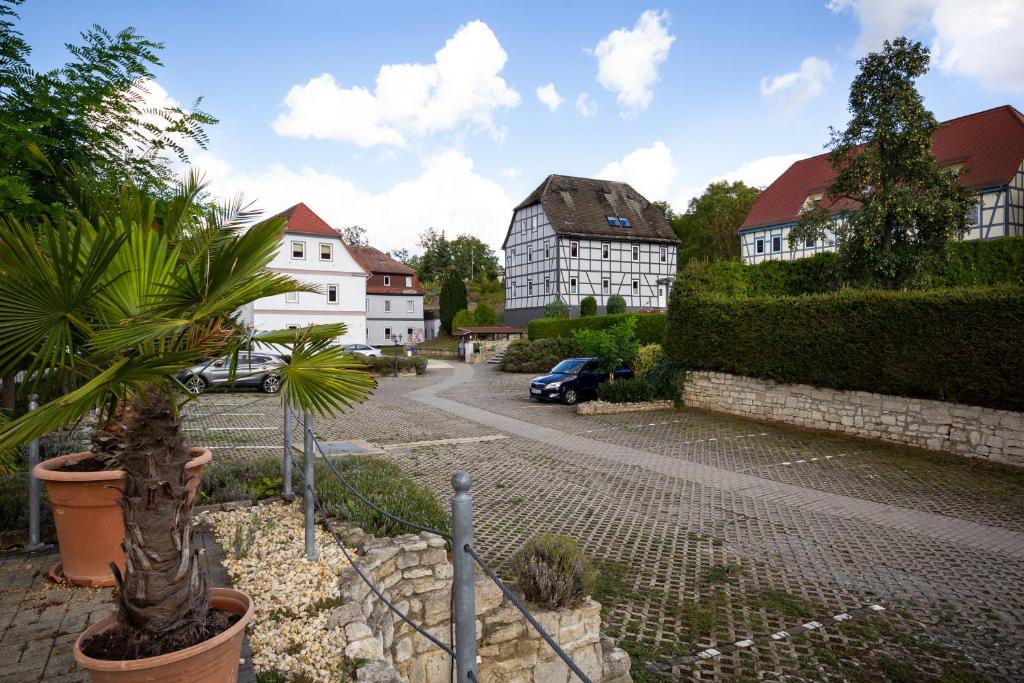 a street in a town with houses and a car at Feriendorf Slawitsch in Bad Sulza