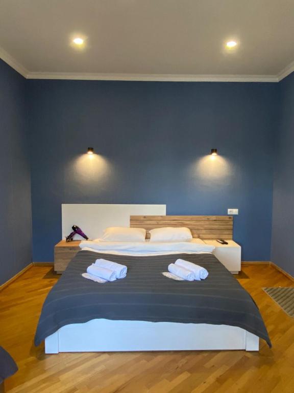 Postel nebo postele na pokoji v ubytování Boutique hotel RaqWine