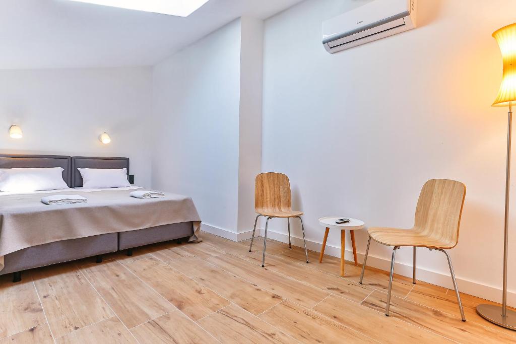 Postel nebo postele na pokoji v ubytování Apartments Magic box II