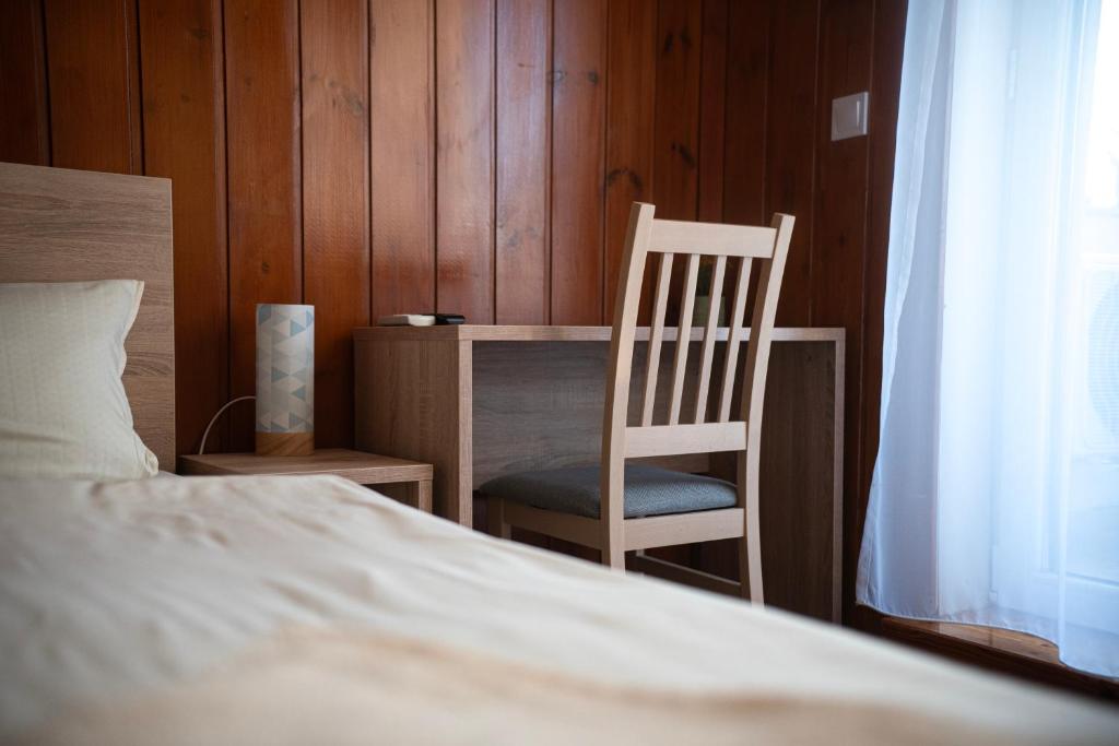 Postel nebo postele na pokoji v ubytování Vadkacsa Panzio