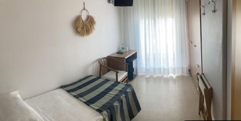 Postel nebo postele na pokoji v ubytování Hotel Sirenetta