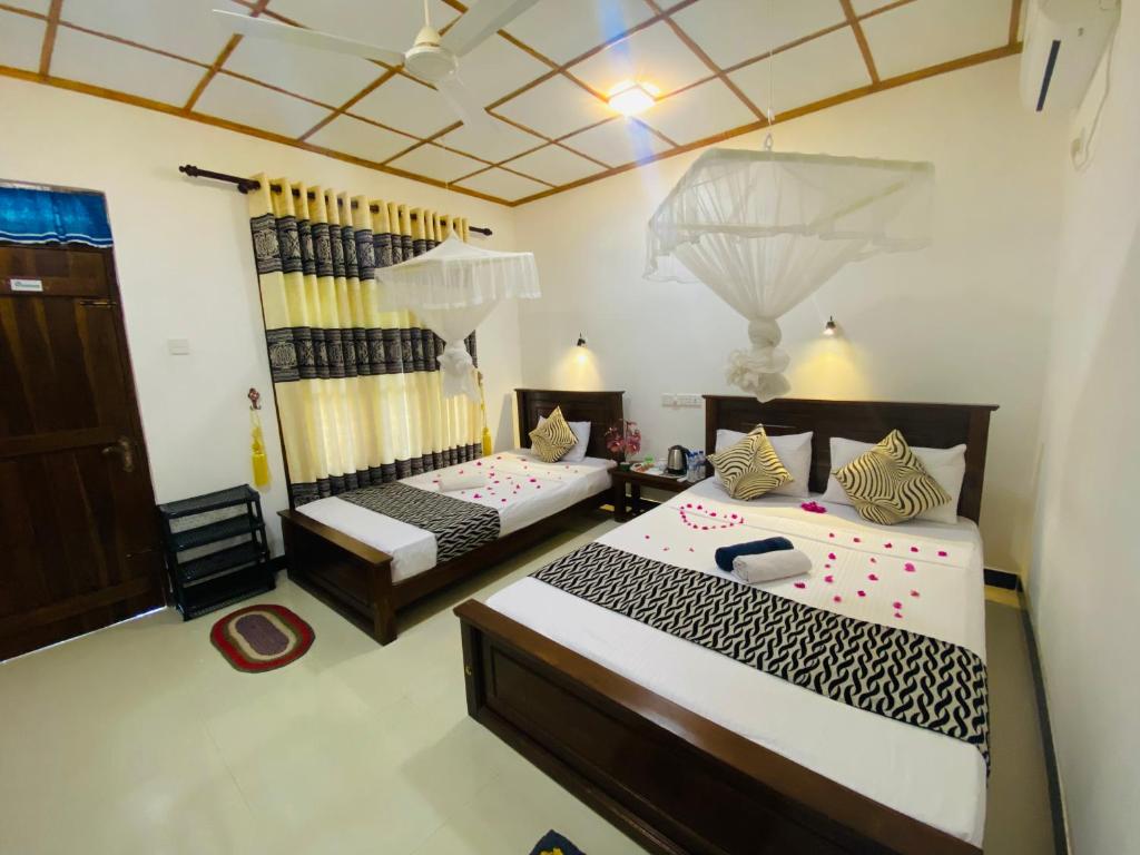 Postel nebo postele na pokoji v ubytování Lucky Villa Sigiriya