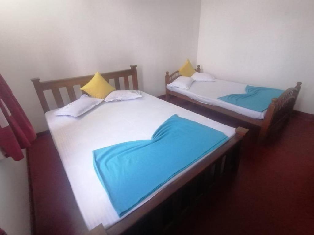 Postel nebo postele na pokoji v ubytování Sunshine Guest House