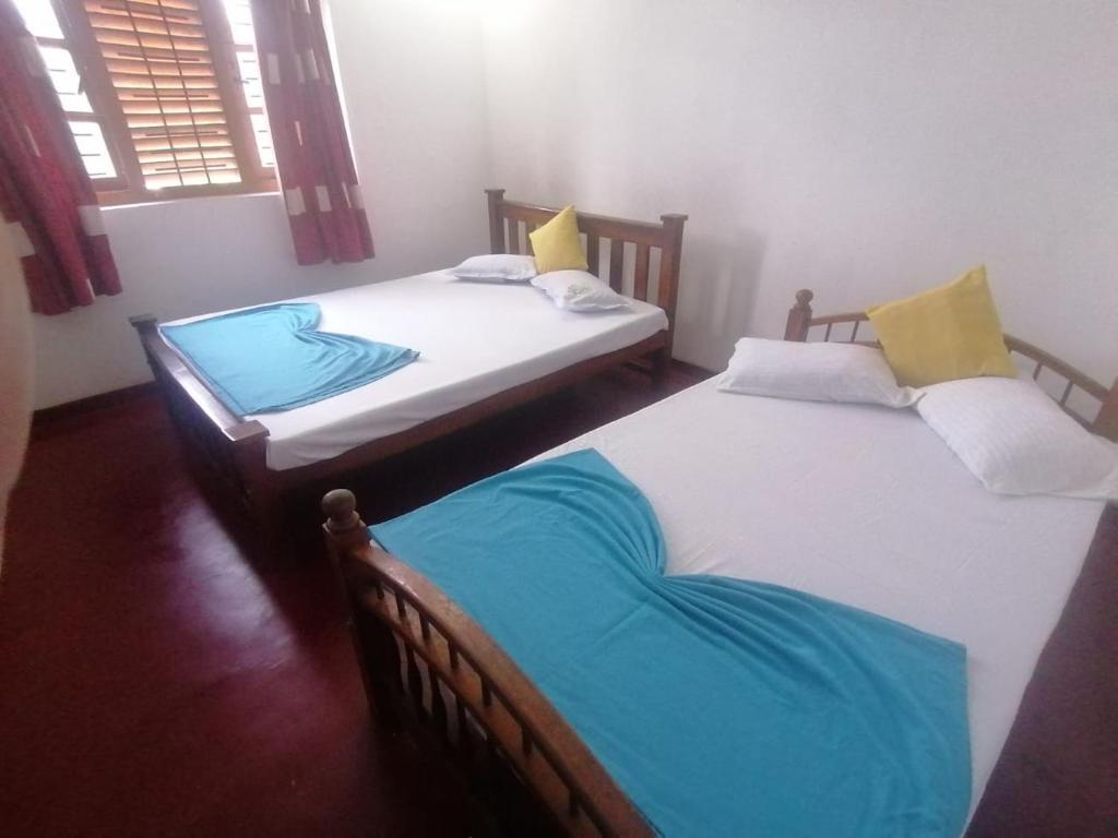 Postel nebo postele na pokoji v ubytování Sunshine Guest House