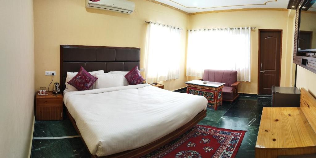Säng eller sängar i ett rum på Hotel Zambala House