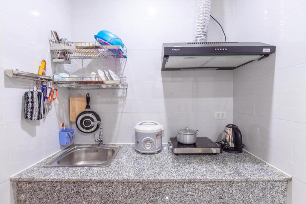 Kuchyň nebo kuchyňský kout v ubytování Bao Ngoc Hotel & Apt