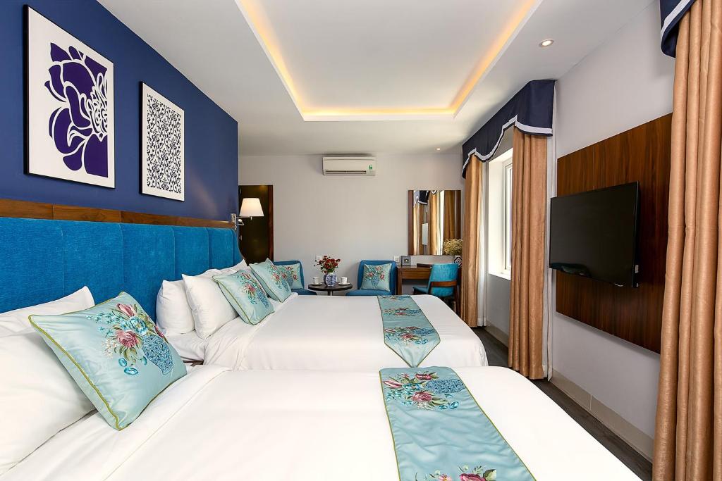 Postel nebo postele na pokoji v ubytování TGT BEACH HOTEL