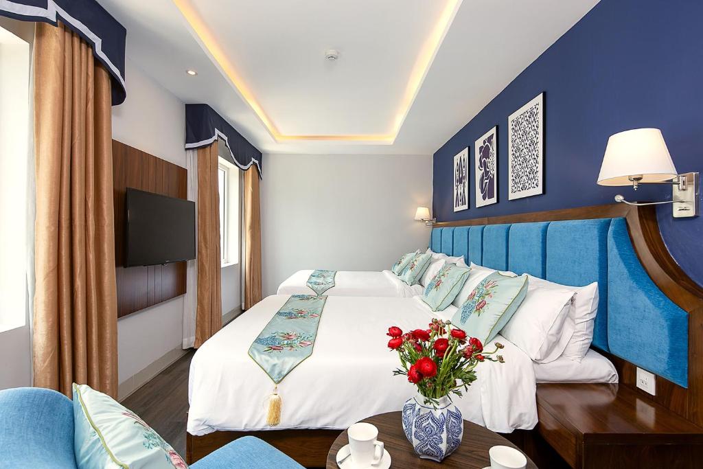 Postel nebo postele na pokoji v ubytování TGT BEACH HOTEL