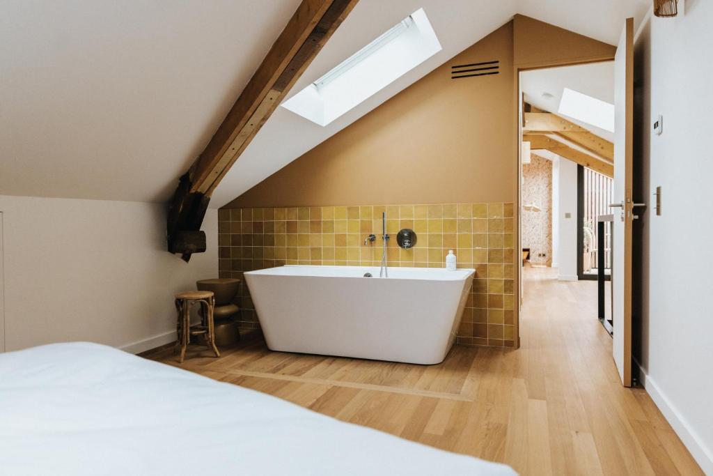 Letto o letti in una camera di Maison Hubert